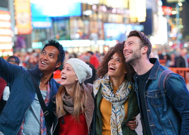 Group of friends having fun at Times Square NYC 1200x854 1